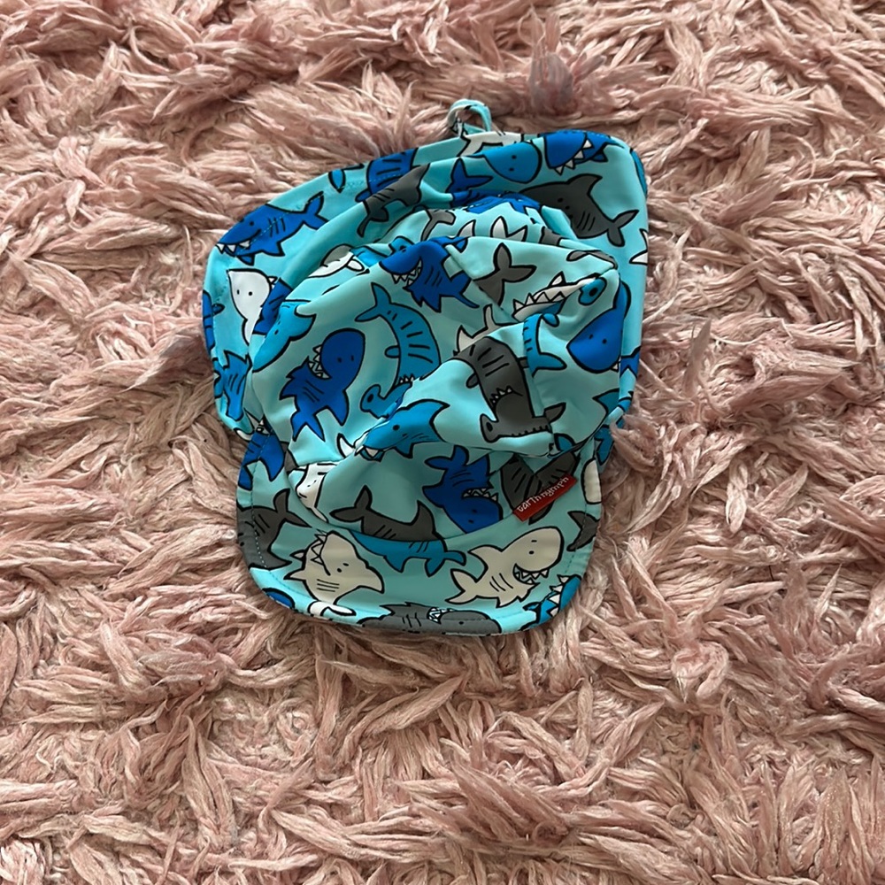 Earth Nymph baby pool hat. One size. Blue with sharks. Great neck protection.